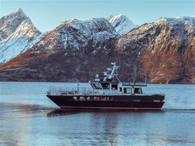 Side view of the Arctic Whale Tours ship