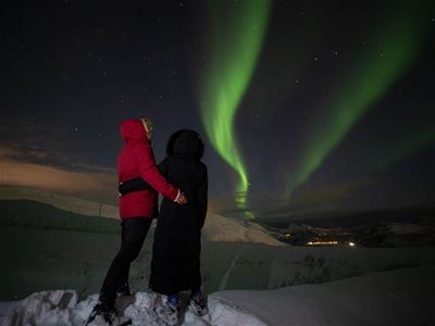 Two guests looking at Northern Lights