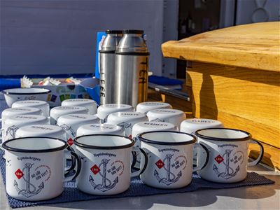 Cups of hot drinks prepared for guests aboard Hermes II during a scenic sightseeing and history cruise in Tromsø.