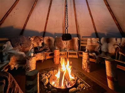 A bonfire inside a lavvo