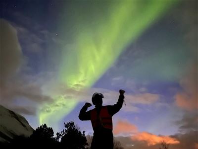 A guest looking at the northern lights
