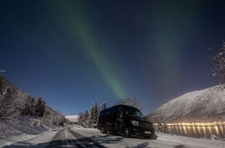Minibus under the northern lights