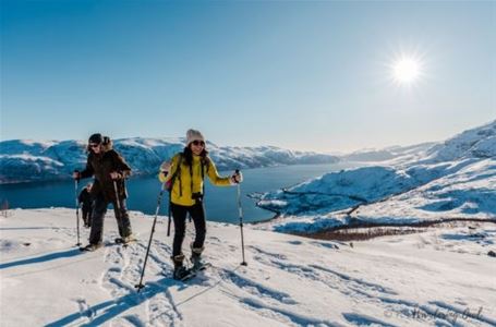 Two guests walking on snowshoes