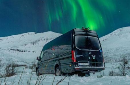 Minibus underneath the northern lights