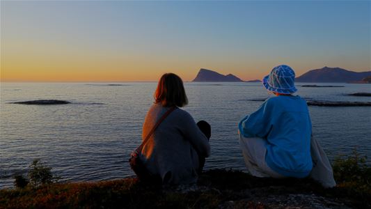 Guests enjoy views of the sea and mountains along the Arctic coast outside Tromsø.