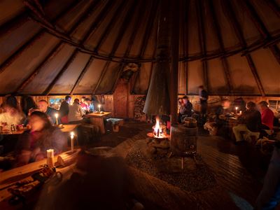Inside the lavvo, guests can sit comfortably and try a traditional Norwegian dish