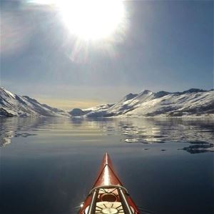 View over snow covered mountains from a kayak