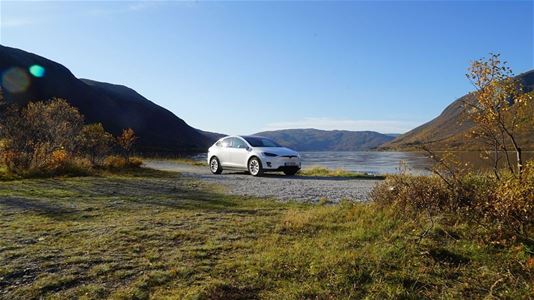 A Tesla in the Arctic landscape