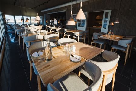The interior with tables set for dining
