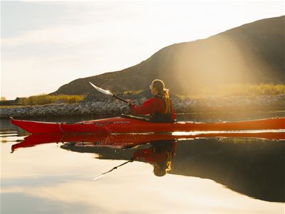 Kayaking in calm waters at Sommarøy