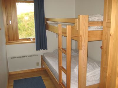 A bedroom with a bunk bed.