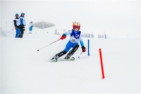 Young skier in slalom competiteon.