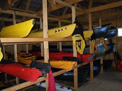 kayaks storage in a barn.